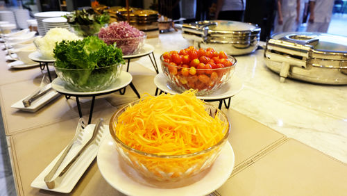 Close-up of vegetables in bowls on table