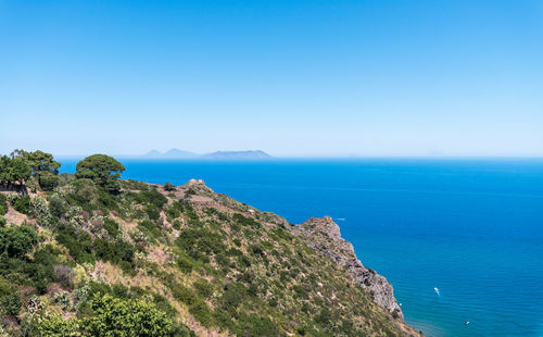Scenic view of sea against clear blue sky