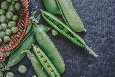 High angle view of green chili peppers on table