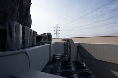 Bridge by buildings against sky