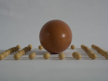 Close-up of eggs against white background