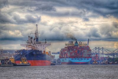 View of commercial dock against cloudy sky