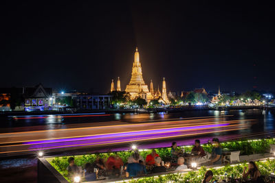 Illuminated buildings in city at night