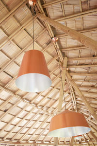 Low angle view of pendant lights hanging on ceiling