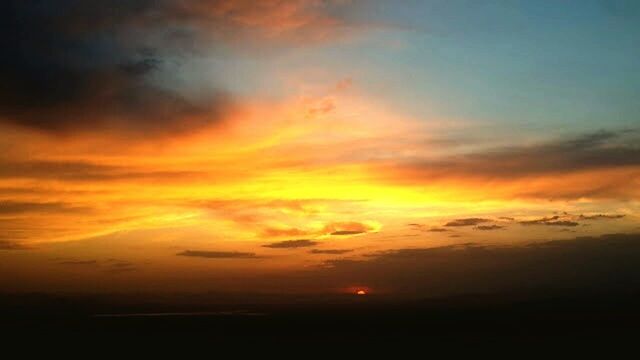 sunset, scenics, sky, beauty in nature, orange color, tranquil scene, tranquility, cloud - sky, dramatic sky, idyllic, nature, silhouette, majestic, cloudy, atmospheric mood, cloud, cloudscape, moody sky, weather, landscape