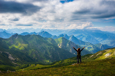 Man standing on mountain against sky