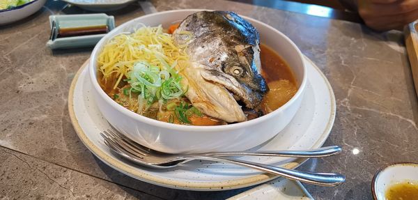 High angle view of fish in bowl on table