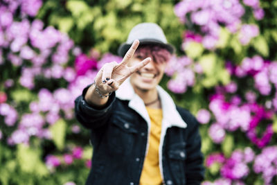 Portrait of smiling man wearing hat against blurred background