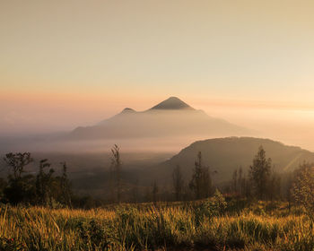 Scenic view of mountains against sky during sunset