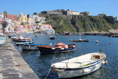 Boats moored at harbor