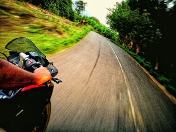 Man riding bicycle on road