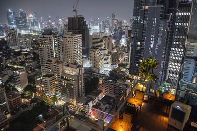 High angle view of illuminated buildings in city at night