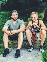 Portrait of young couple sitting outdoors