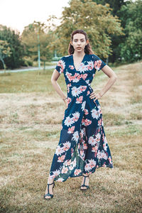 Portrait of woman standing on field