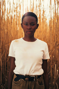 Portrait of young man standing on land