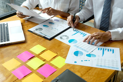 High angle view of man using laptop on table