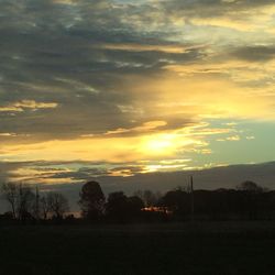 Scenic view of landscape against sky at sunset