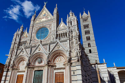 Low angle view of building against blue sky