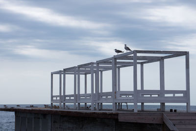 Pier over sea against sky