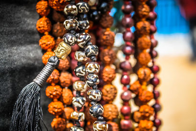 Close-up of multi colored jewelry for sale in market