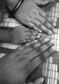 Midsection of couple holding hands