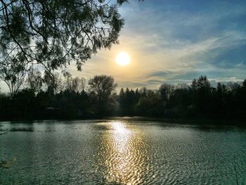 Scenic view of lake at sunset