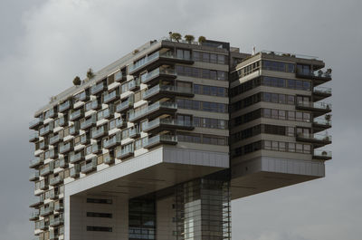 Low angle view of office building against sky