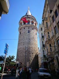 Low angle view of buildings against blue sky