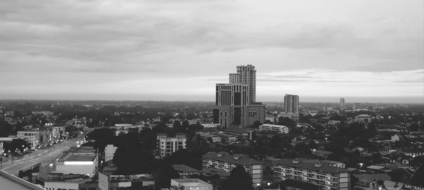 High angle view of modern buildings in city against sky