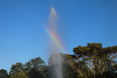 Rainbow over waterfall