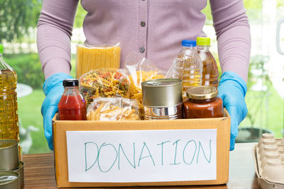 Midsection of man preparing food on table