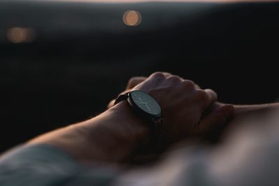 Close-up of human hand against blurred background