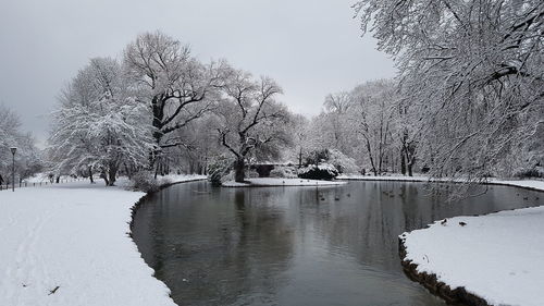 Scenic view of lake against clear sky during winter