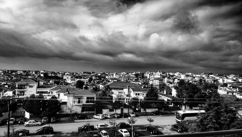 High angle view of buildings in city against sky