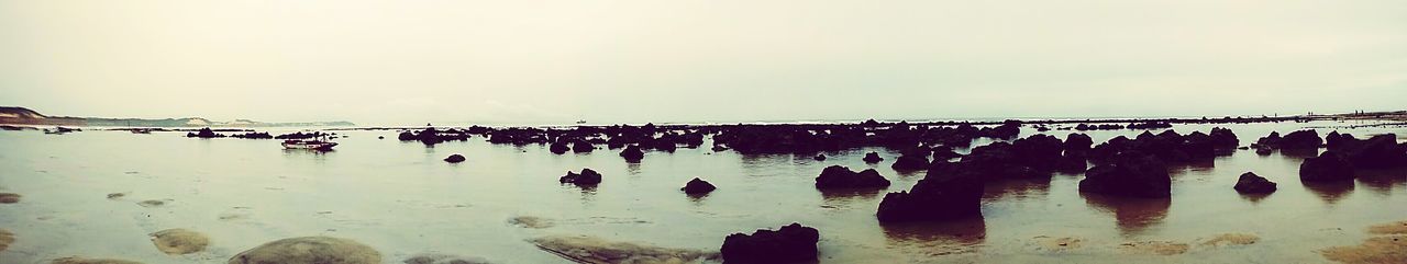 Panoramic view of sea against clear sky