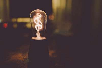 Close-up of illuminated light bulb