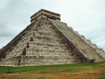 Low angle view of chichen itza against sky