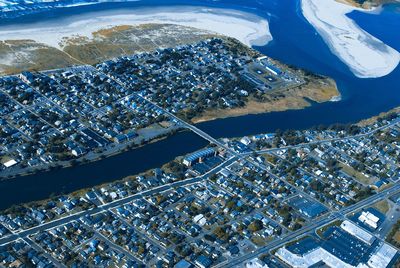 High angle view of cityscape against blue sky