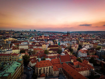 High angle shot of townscape against sky at sunset