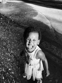 Portrait of girl screaming outdoors