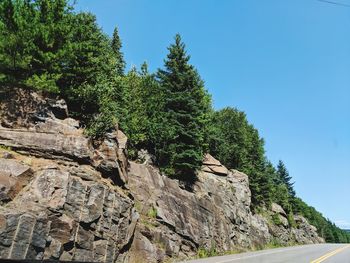 Low angle view of rocks against sky
