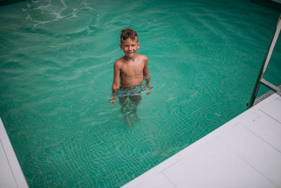 High angle view of man swimming in pool