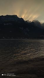 Scenic view of sea against sky at sunset