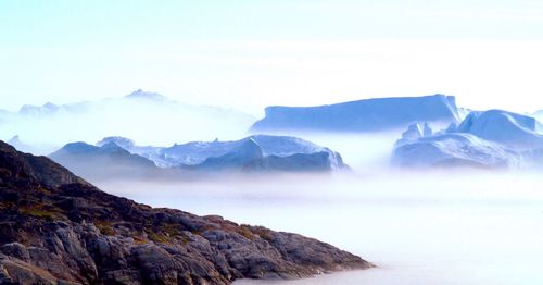 Scenic view of mountains during foggy weather