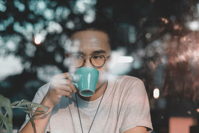 Portrait of man drinking coffee