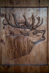 Close-up of carving on wooden table