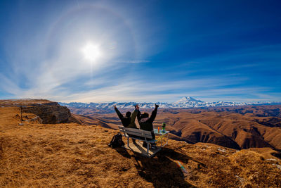 Man on mountain against sky