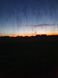 Scenic view of silhouette landscape against sky at sunset