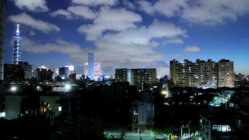 View of skyscrapers lit up at night