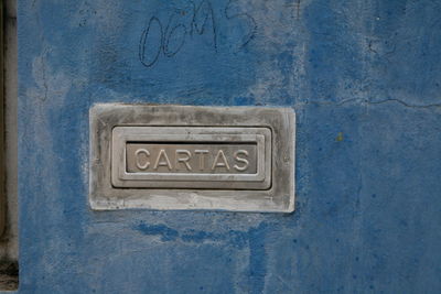 Close-up of text on wall